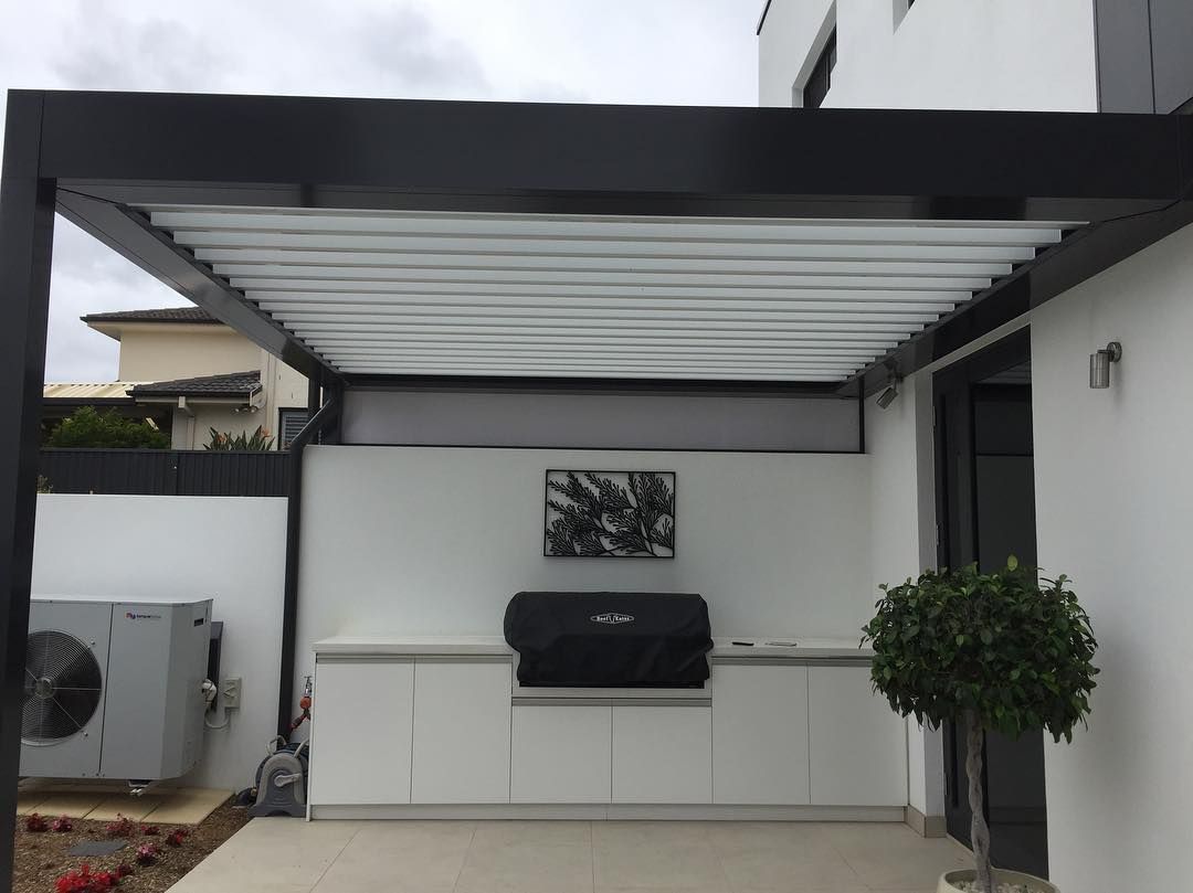 Outdoor Kitchen With White Cabinets, Grill Under a Pergola — Narellan Home Improvement Centre In Campbelltown, NSW