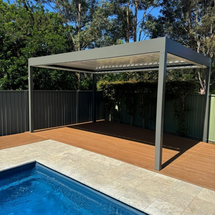 Pergola Over Wooden Deck Beside a Pool — Narellan Home Improvement Centre In Southern Highlands, NSW