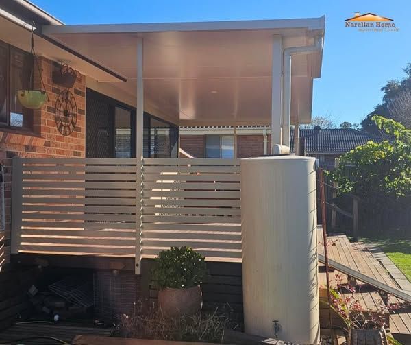 A Covered Outdoor Patio With Horizontal Slat Fencing — Narellan Home Improvement Centre In Orange, NSW