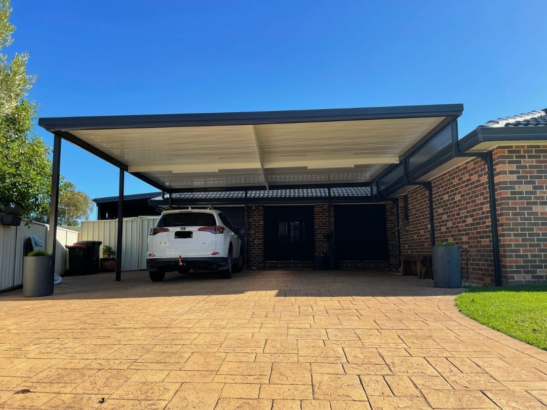 Carport With a White Suv Parked Underneath — Narellan Home Improvement Centre In Liverpool, NSW