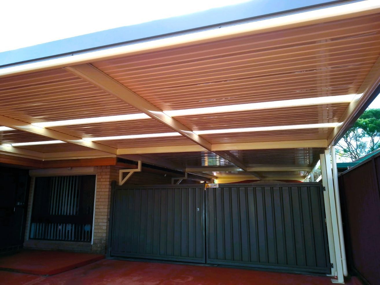 Carport With a Brown Corrugated Roof — Narellan Home Improvement Centre In Coffs Harbour, NSW