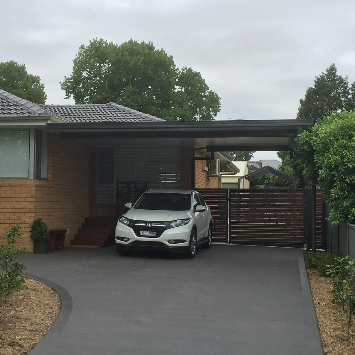 White SUV Parked Under a Carport — Narellan Home Improvement Centre In Campbelltown, NSW