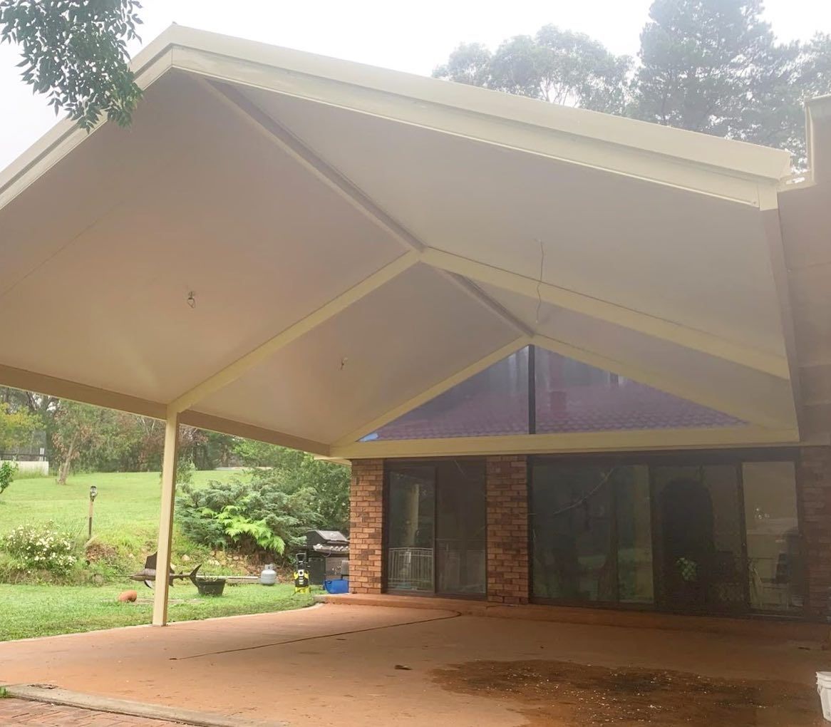 Beige Carport With a Brick House — Narellan Home Improvement Centre In Campbelltown, NSW