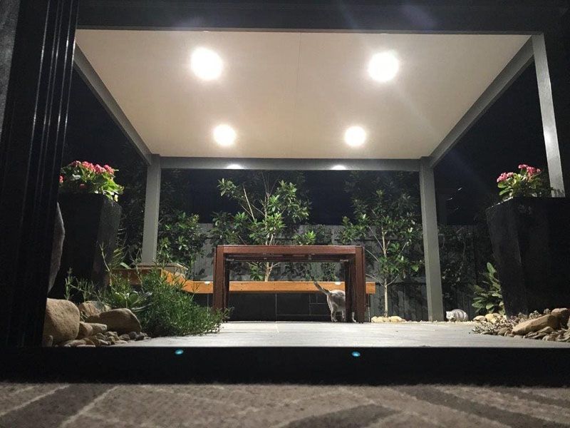 A Covered Outdoor Seating Area at Night, Lit by Recessed Lights — Narellan Home Improvement Centre In Narellan, NSW