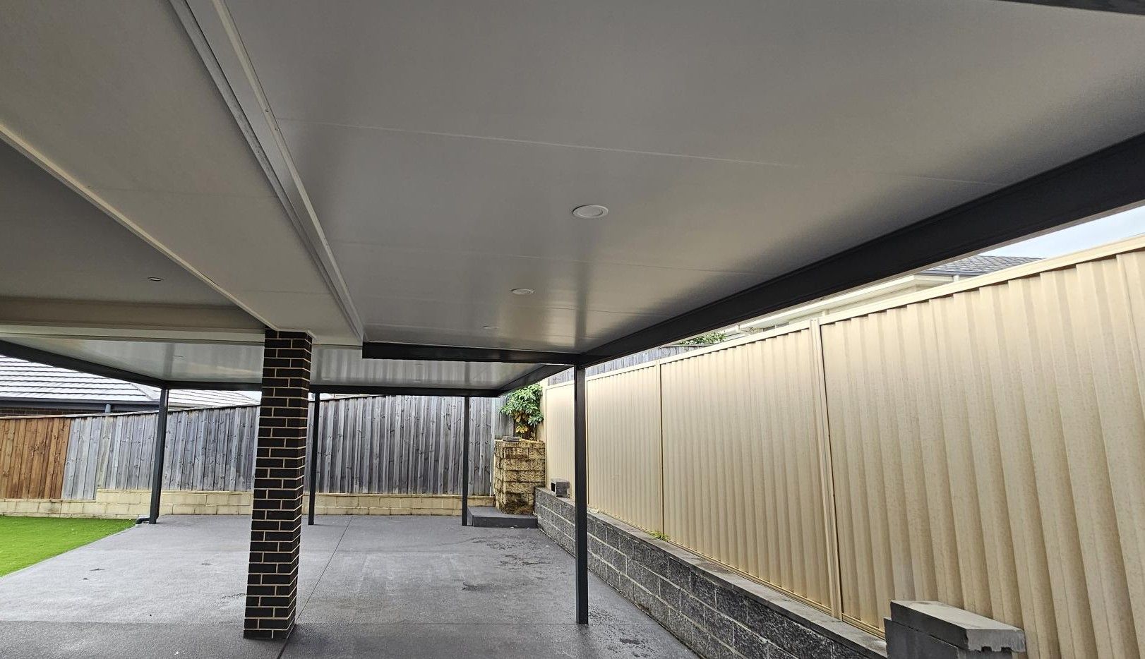 A Long, Covered Deck With Reddish-brown Wooden Planks — Narellan Home Improvement Centre In Narellan, NSW