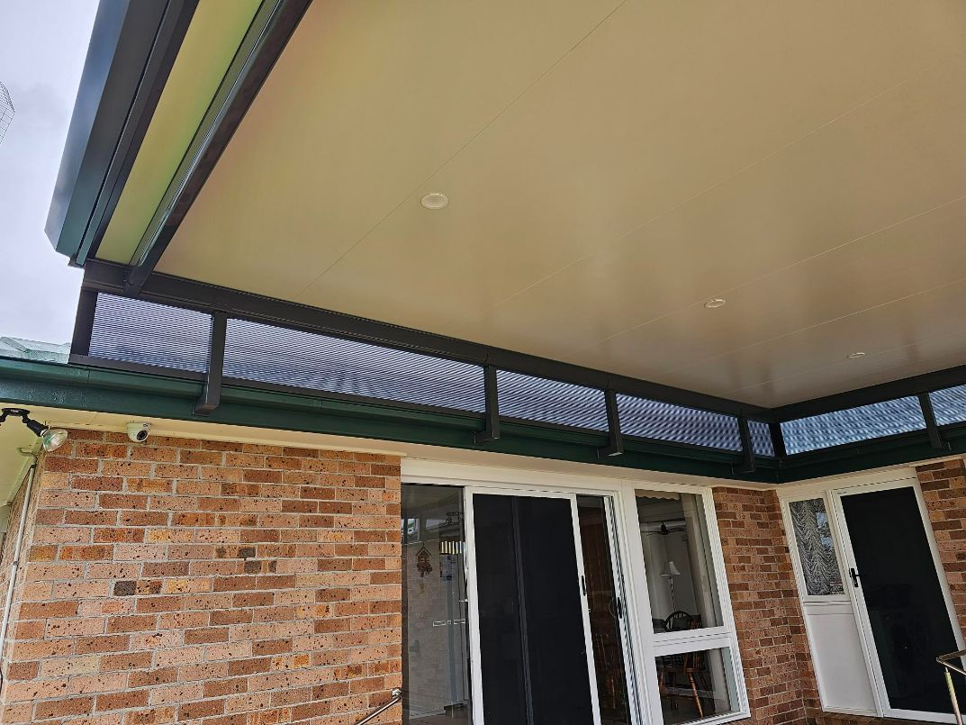 Brick House With a Covered Patio, Featuring a Dark Lattice — Narellan Home Improvement Centre In Coffs Harbour, NSW