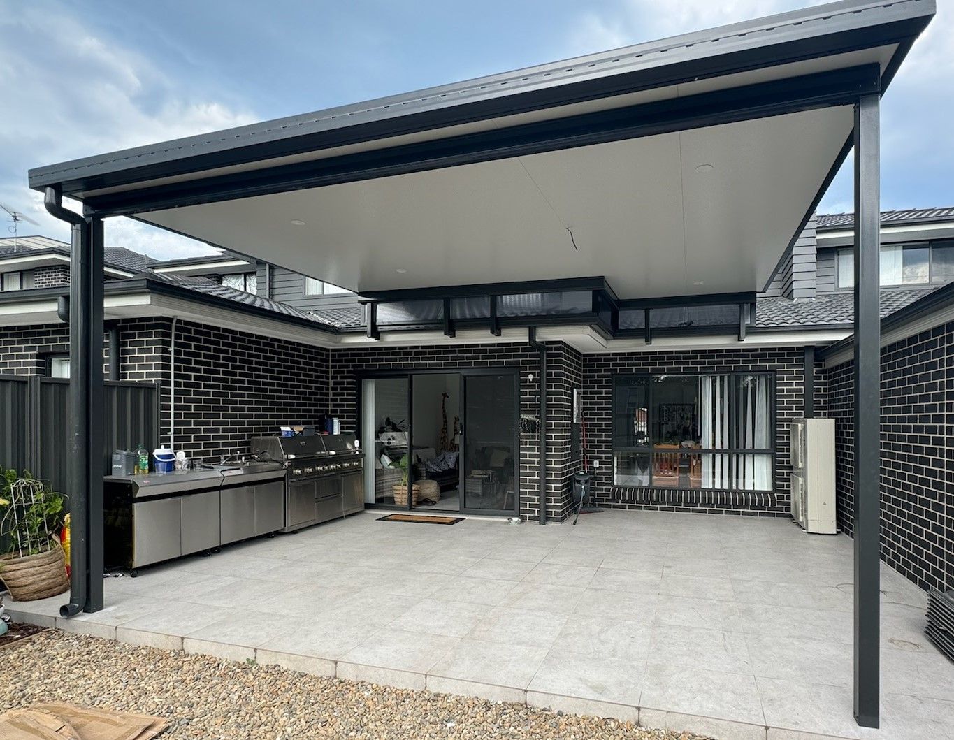 Two-story Beige House With Stainless Steel Railings, and a Garage Door — Narellan Home Improvement Centre In Narellan, NSW