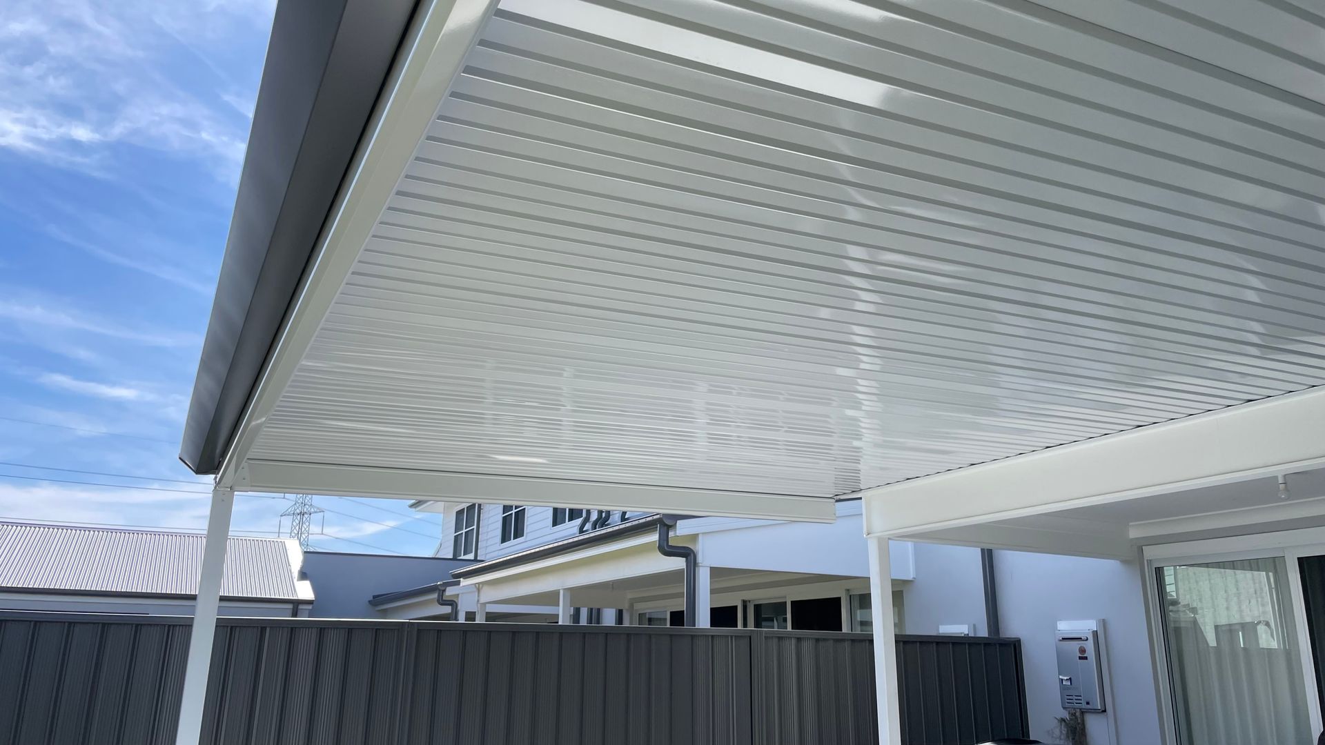 Beige Building With a Balcony, Railing, and Trees — Narellan Home Improvement Centre In Narellan, NSW