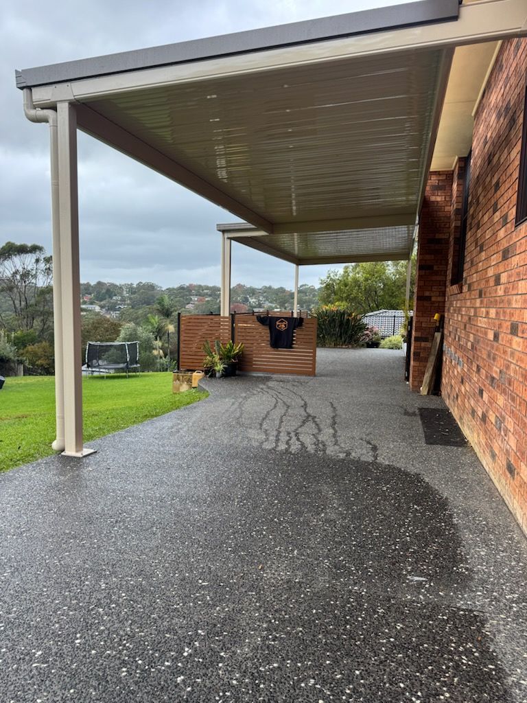 Two-story White House With a Balcony, Solar Panels, and a Red-tiled Roof — Narellan Home Improvement Centre In Narellan, NSW