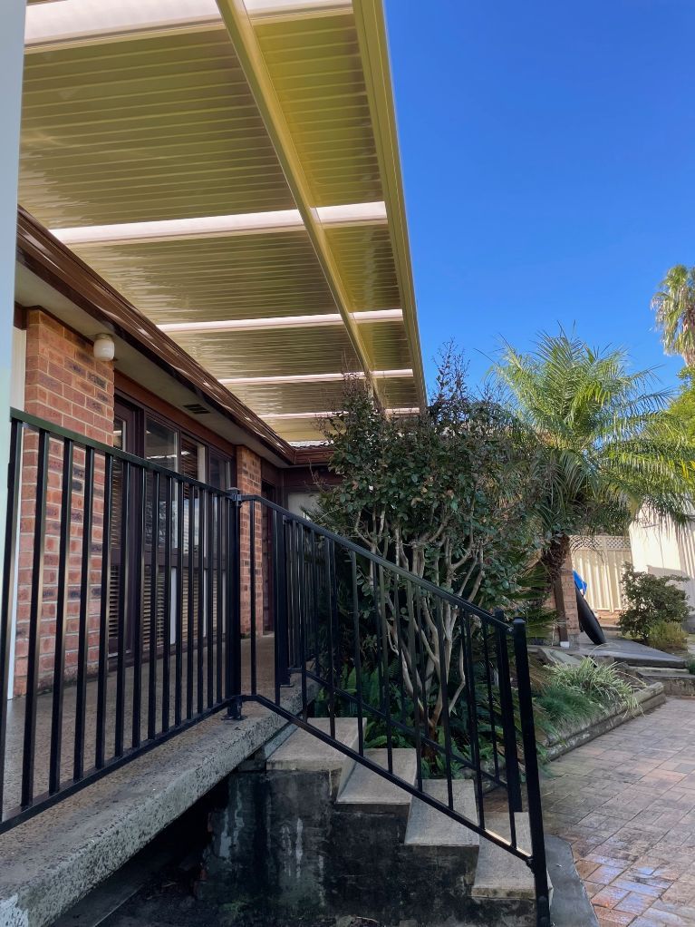 Brick House With Black Railing, and Covered Pergola — Narellan Home Improvement Centre In Southern Highlands, NSW