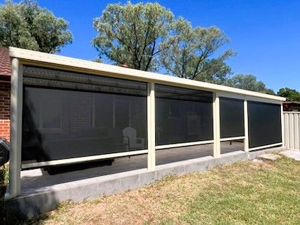 Patio With Black Tiled Floor, Black Roof and Supports — Narellan Home Improvement Centre In Narellan, NSW