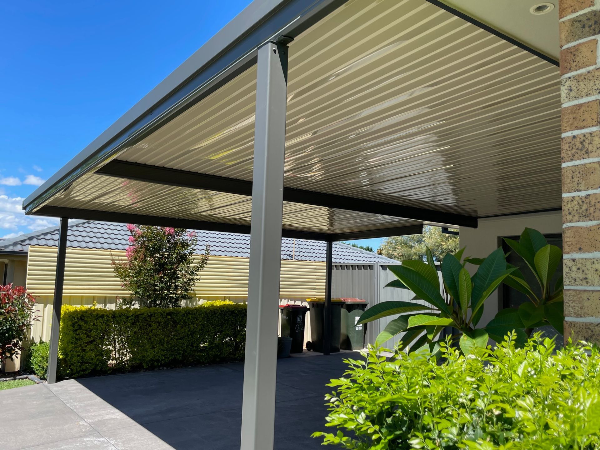 Patio With Flat, Light-colored Roof, Black Beams, and Brick Wall — Narellan Home Improvement Centre In Narellan, NSW