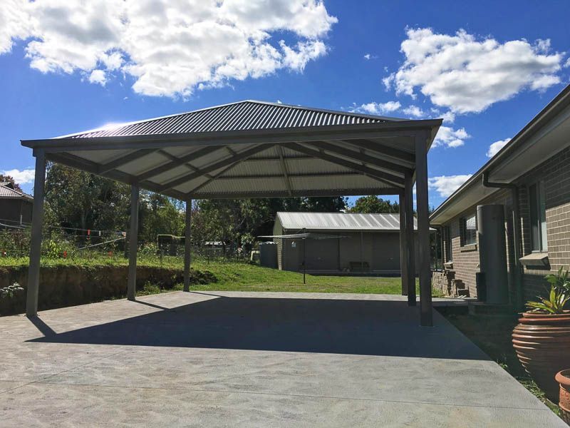 Carport With a Grey Metal Roof, on a Concrete Driveway — Narellan Home Improvement Centre In Narellan, NSW