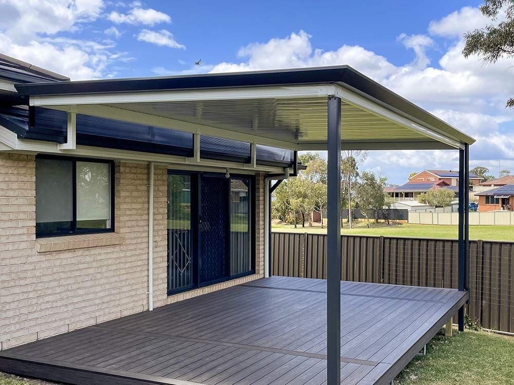 Deck With a Black-framed Pergola — Narellan Home Improvement Centre In Narellan, NSW