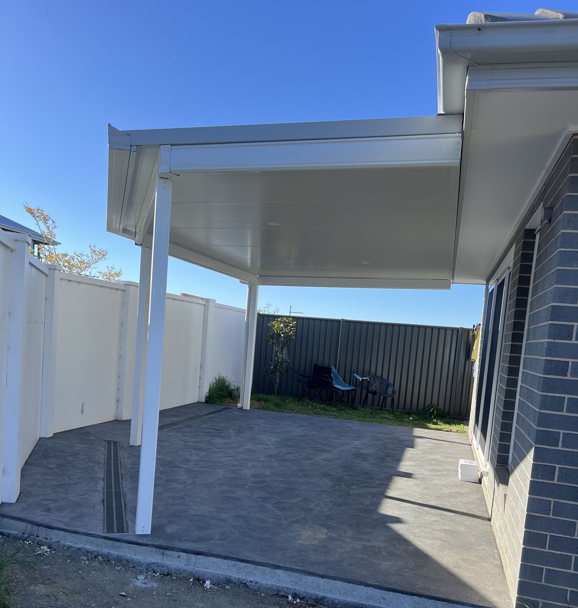 Beige Building With Balcony, Metal Railing, and Retractable Awnings — Narellan Home Improvement Centre In Narellan, NSW