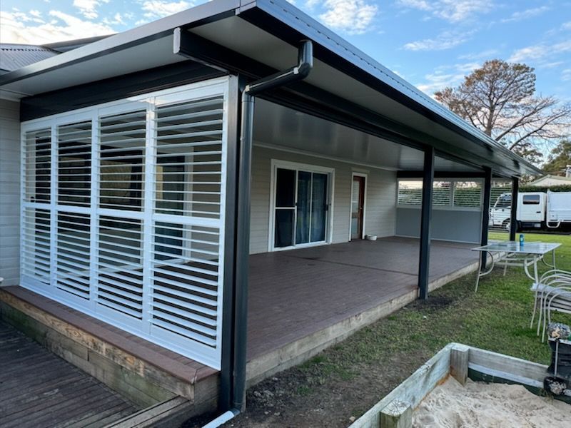 Covered Patio With White Shutters, Dark Trim, and Gray Walls — Narellan Home Improvement Centre In Narellan, NSW