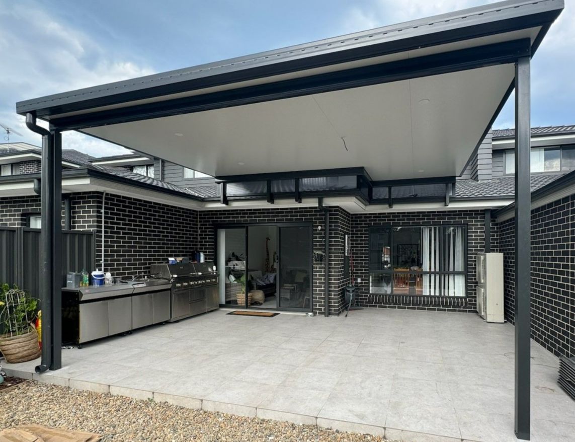 Pergola With Black Frame, White Roof, Outdoor Kitchen, Grey Tiles — Narellan Home Improvement Centre In Narellan, NSW