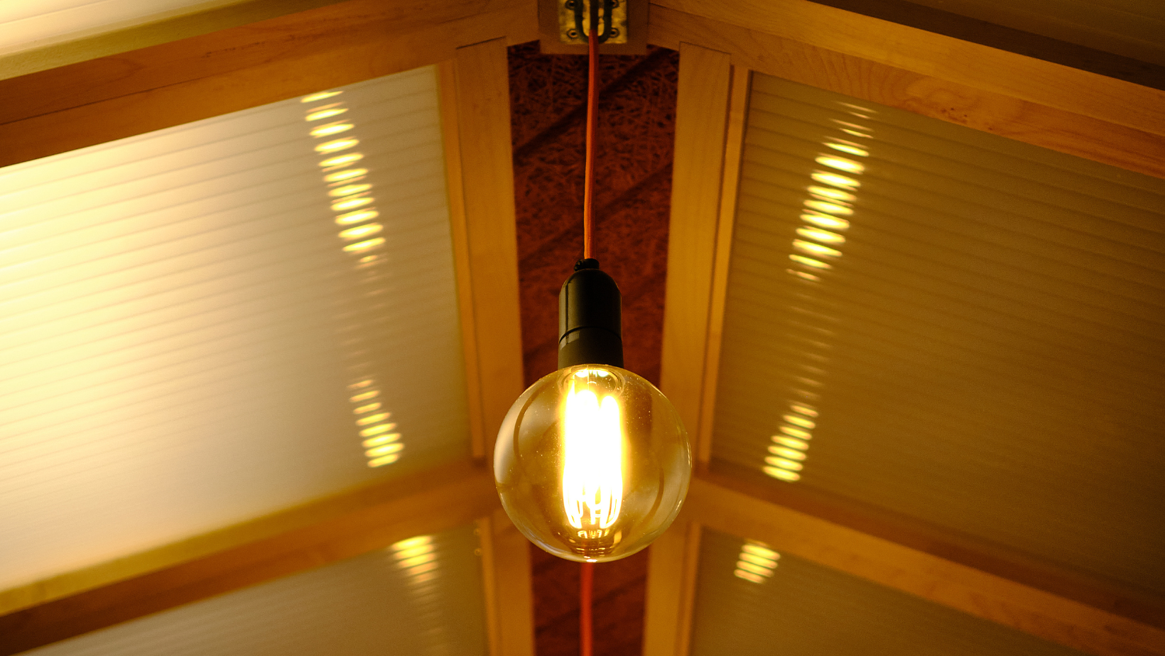 a light bulb is hanging from the ceiling in a room