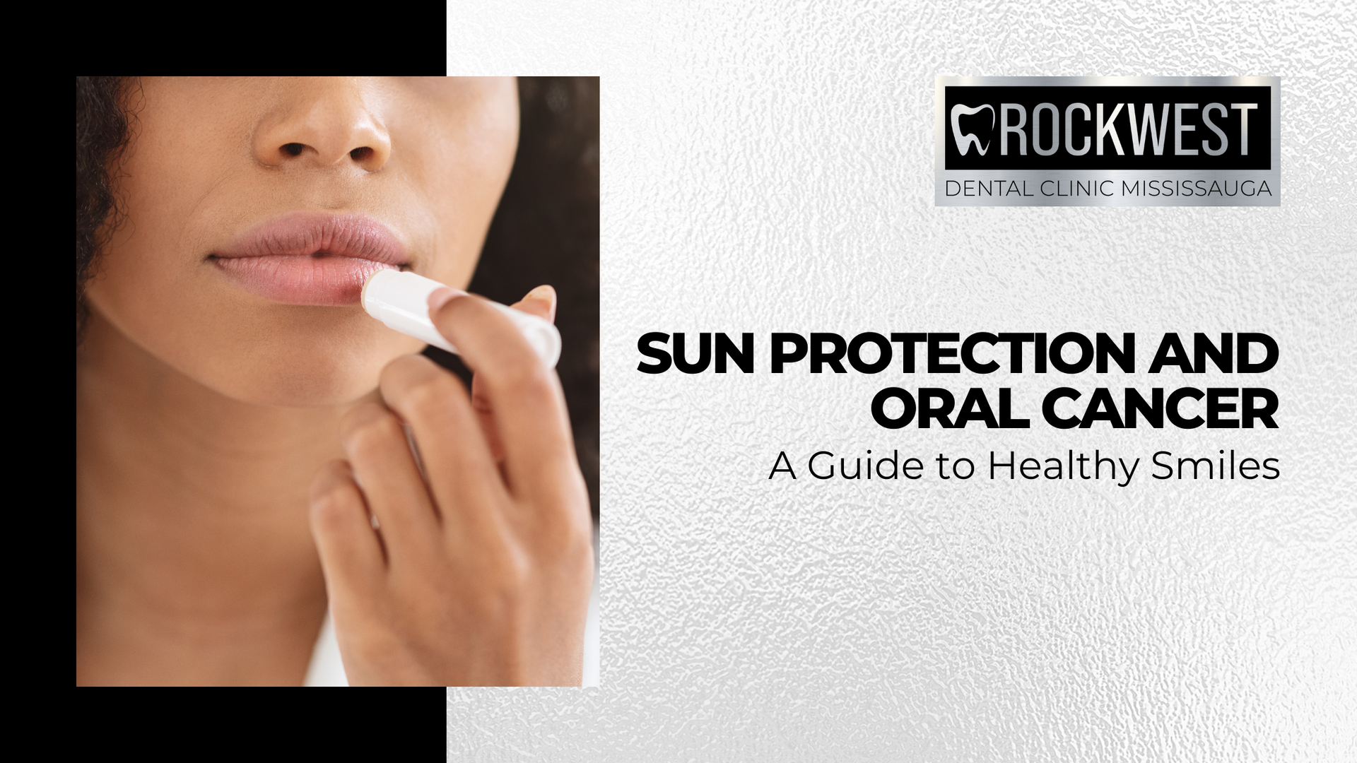 A woman is applying lip balm to her lips.