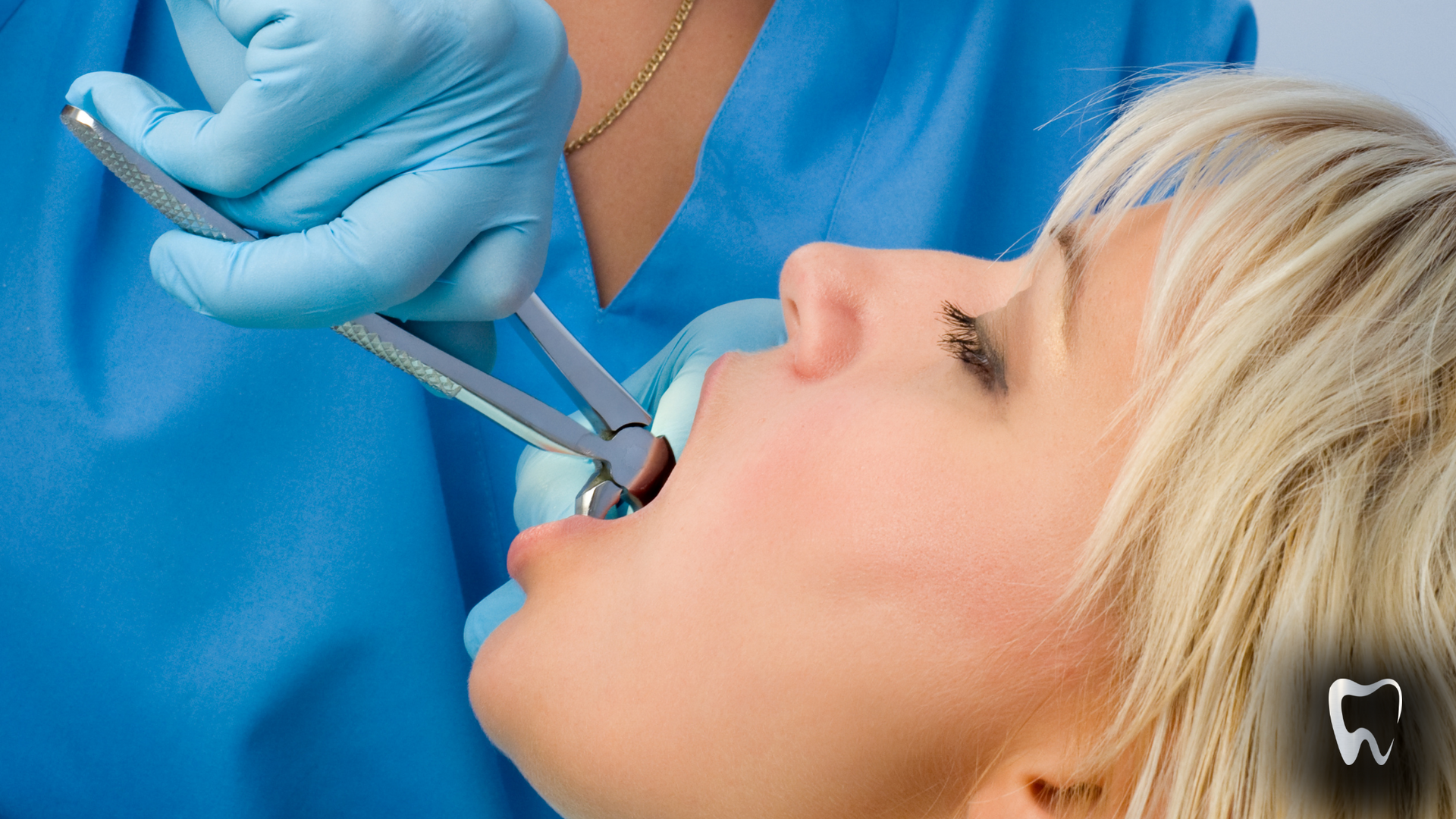 A woman is getting her teeth removed by a dentist.