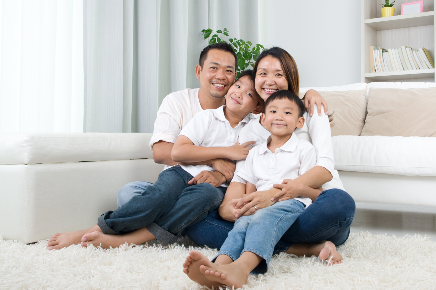 Woman in dental chair, holding clear aligner, smiling.