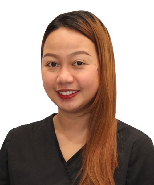 A woman with long brown hair is wearing a black shirt and smiling