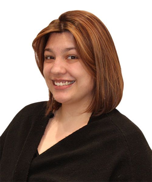 A woman with brown hair is smiling and wearing a black shirt