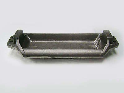 A metal tray with handles is sitting on a white surface.