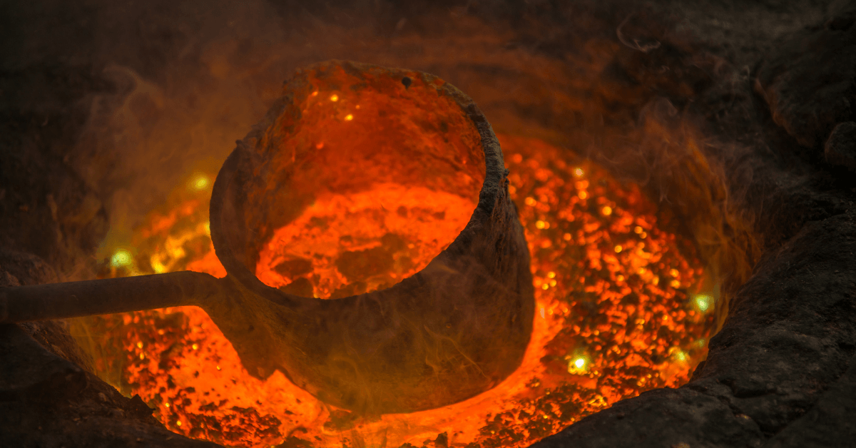 A ladle is being poured into a pot of molten metal.