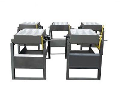 A group of metal boxes sitting next to each other on a white background.