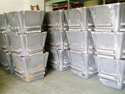 A warehouse filled with lots of containers stacked on top of each other.