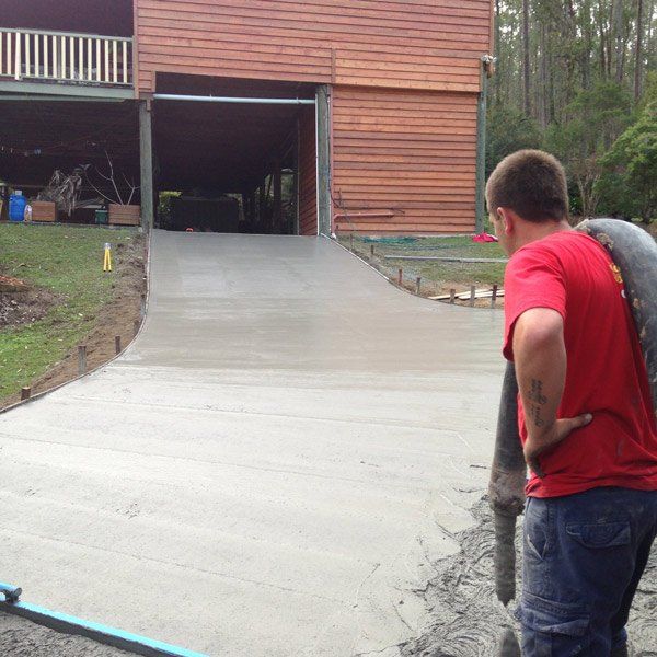 man pouring concrete