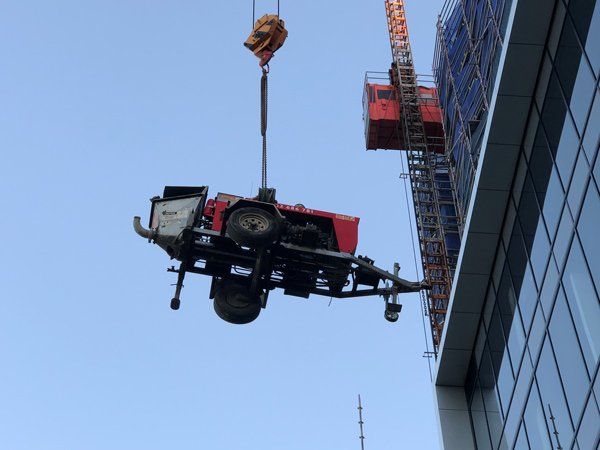 lifting a trailer on a crane