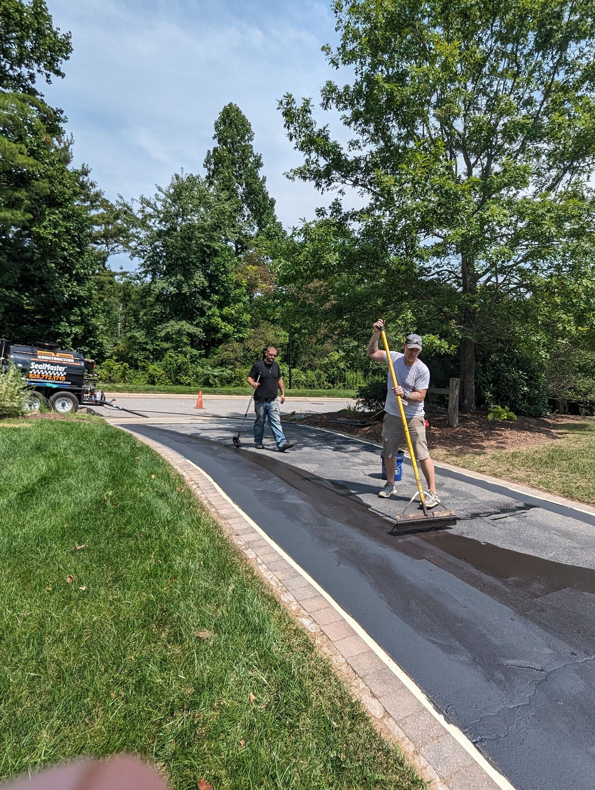 A group of men are working on a road.