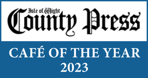 A blue sign that says county press cafe of the year 2023