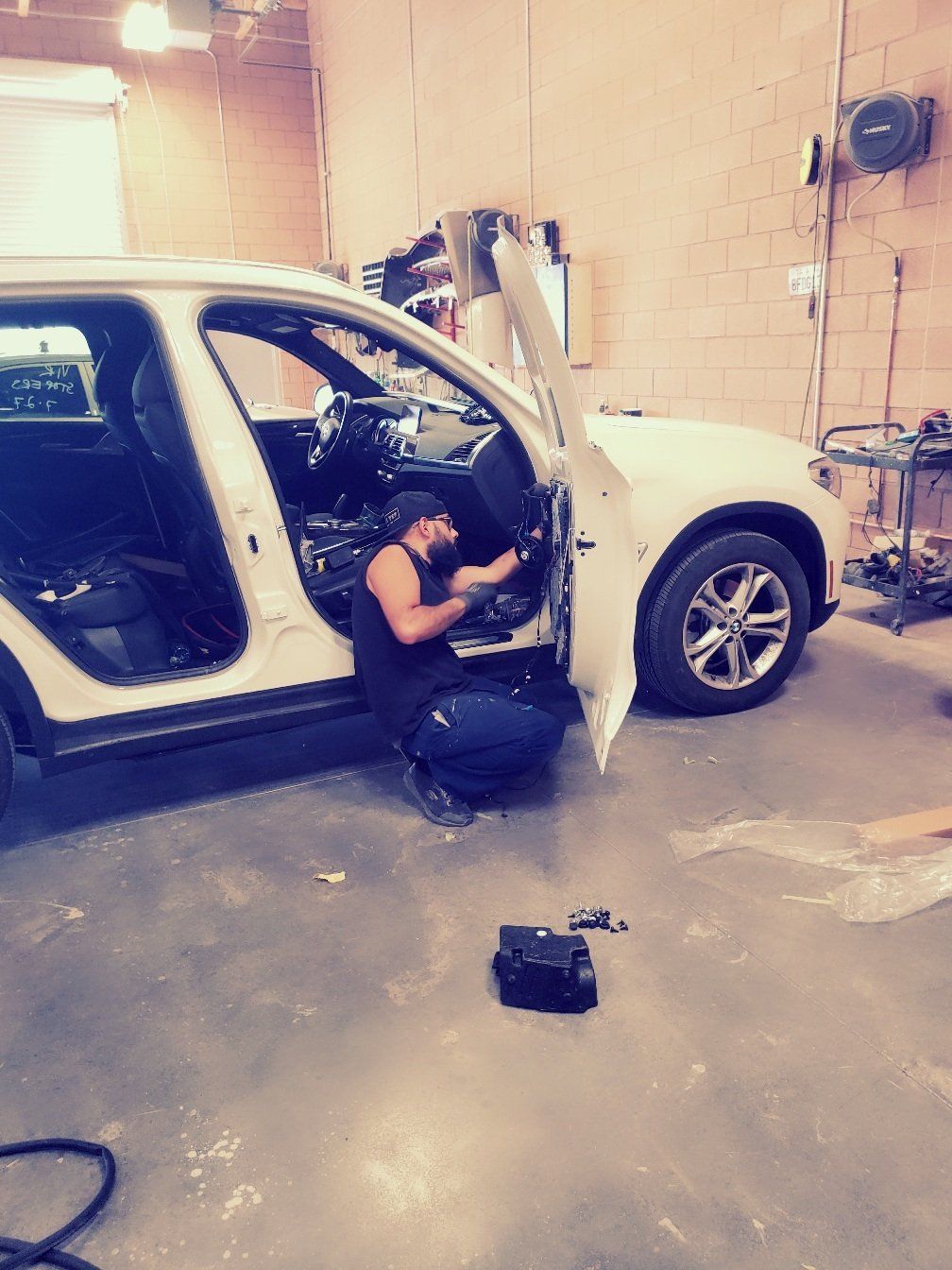 Car Damage — Man Fixing The Door of a Car in Las Vegas, NV