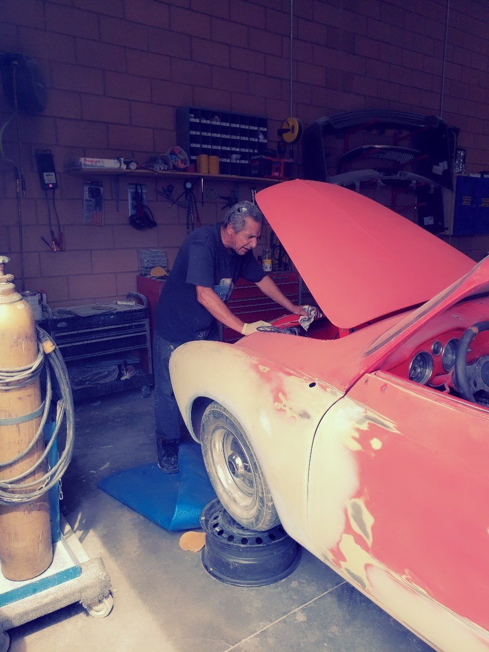 Body Shop — Man Fixing The Front Bumper of The Car in Las Vegas, NV