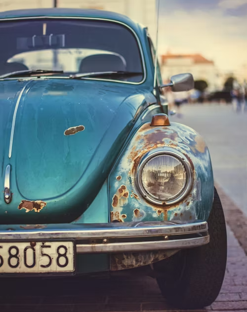 A blue car with a license plate that says 58058