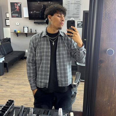A man is taking a picture of himself in a mirror