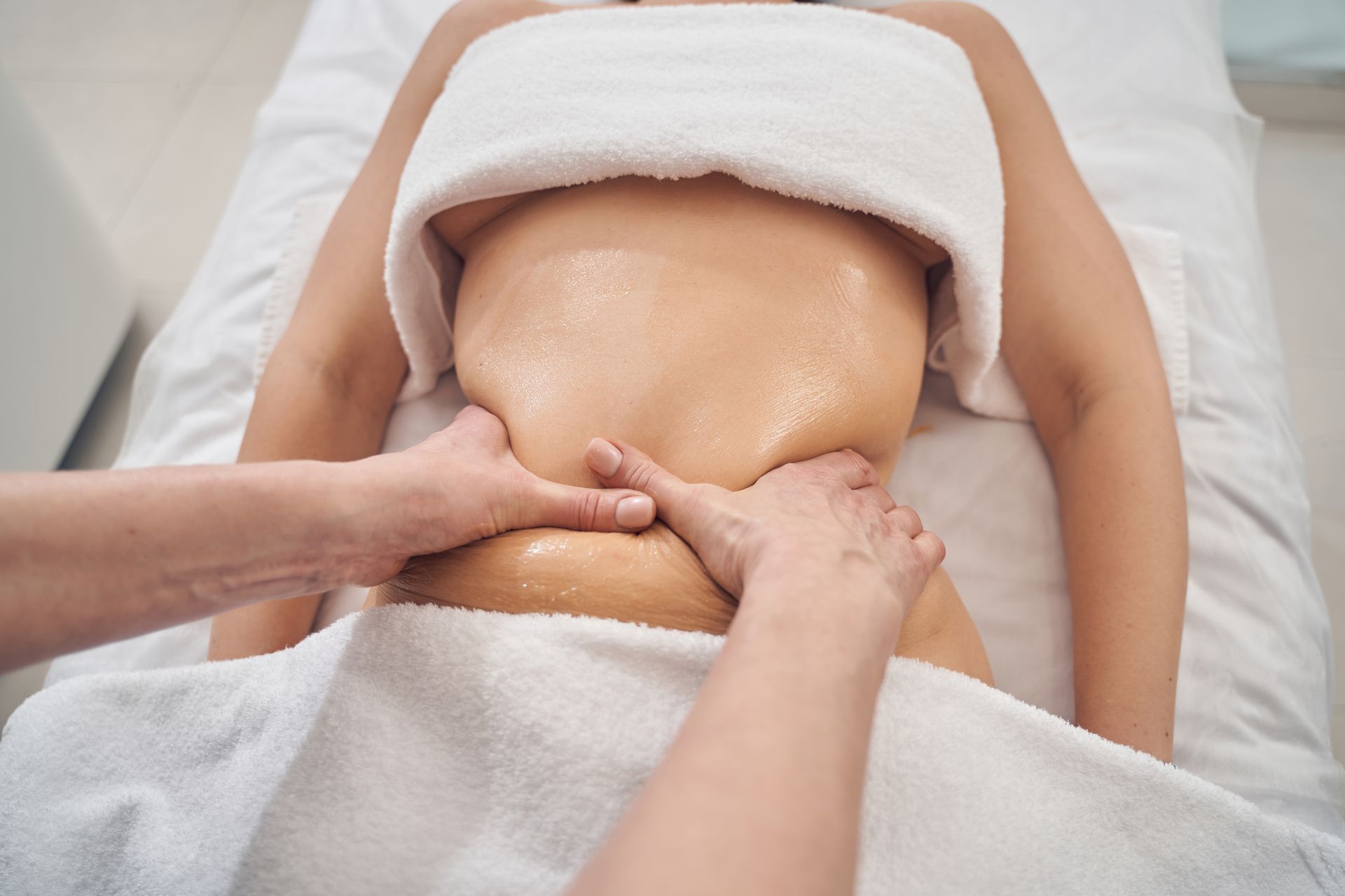 A woman is getting a massage at a spa.