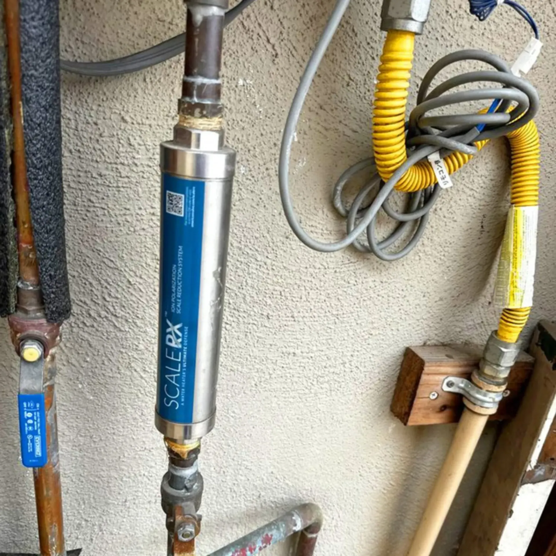 GTZ Plumbing Service LLC - A scalerx gas filter is attached to a pipe