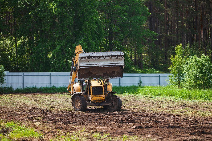 worker driving the excavator