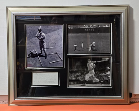 Framed black and white baseball photos of a batter with a description; silver frame.