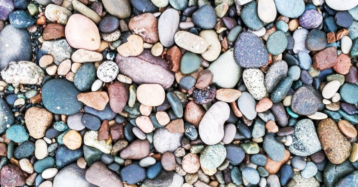 A pile of colorful rocks on a beach.