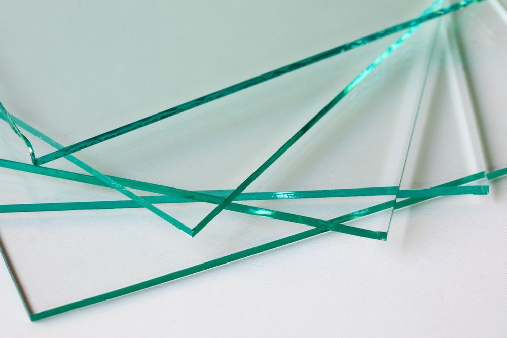 A Several Sheets of Translucent Green Glass — Downs Window Renewals in Harristown, QLD