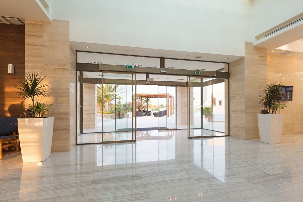 Automatic Glass Doors at A Building Entrance — Downs Window Renewals in Harristown, QLD