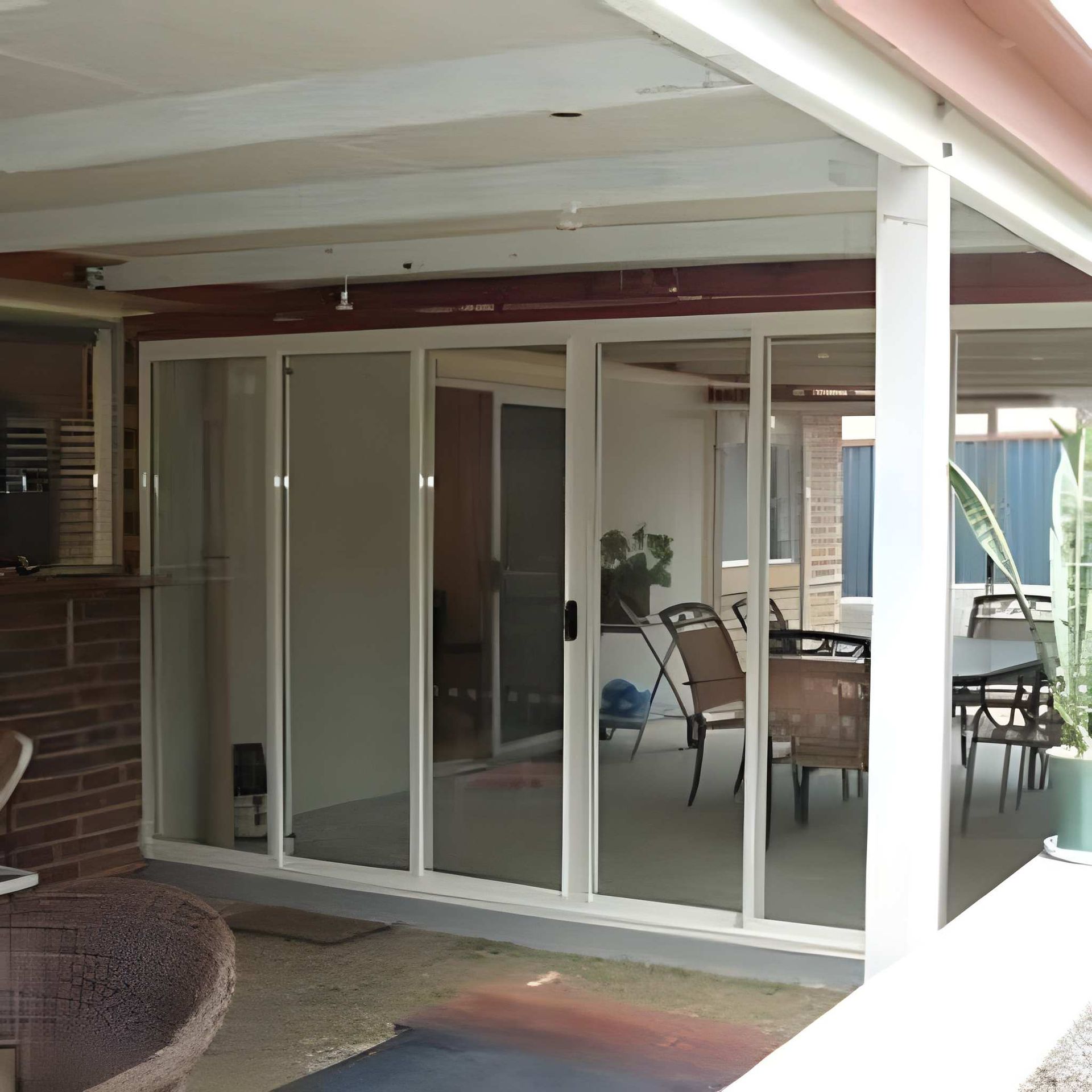 A Sliding Glass Doors on A Patio — Downs Window Renewals in Harristown, QLD