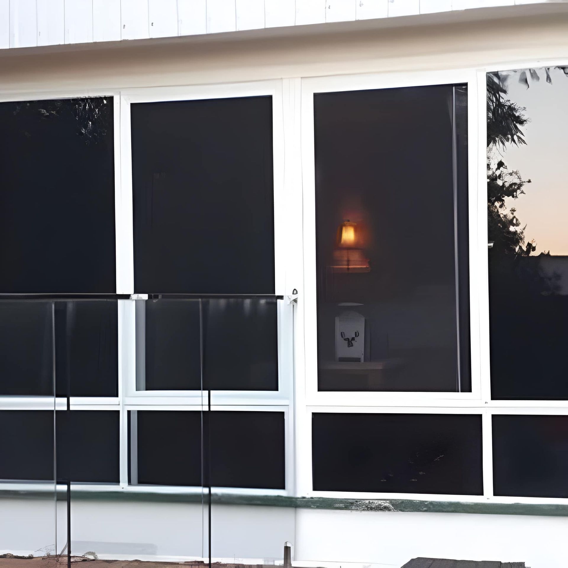 A Framed Windows with Black Shades — Downs Window Renewals in Harristown, QLD