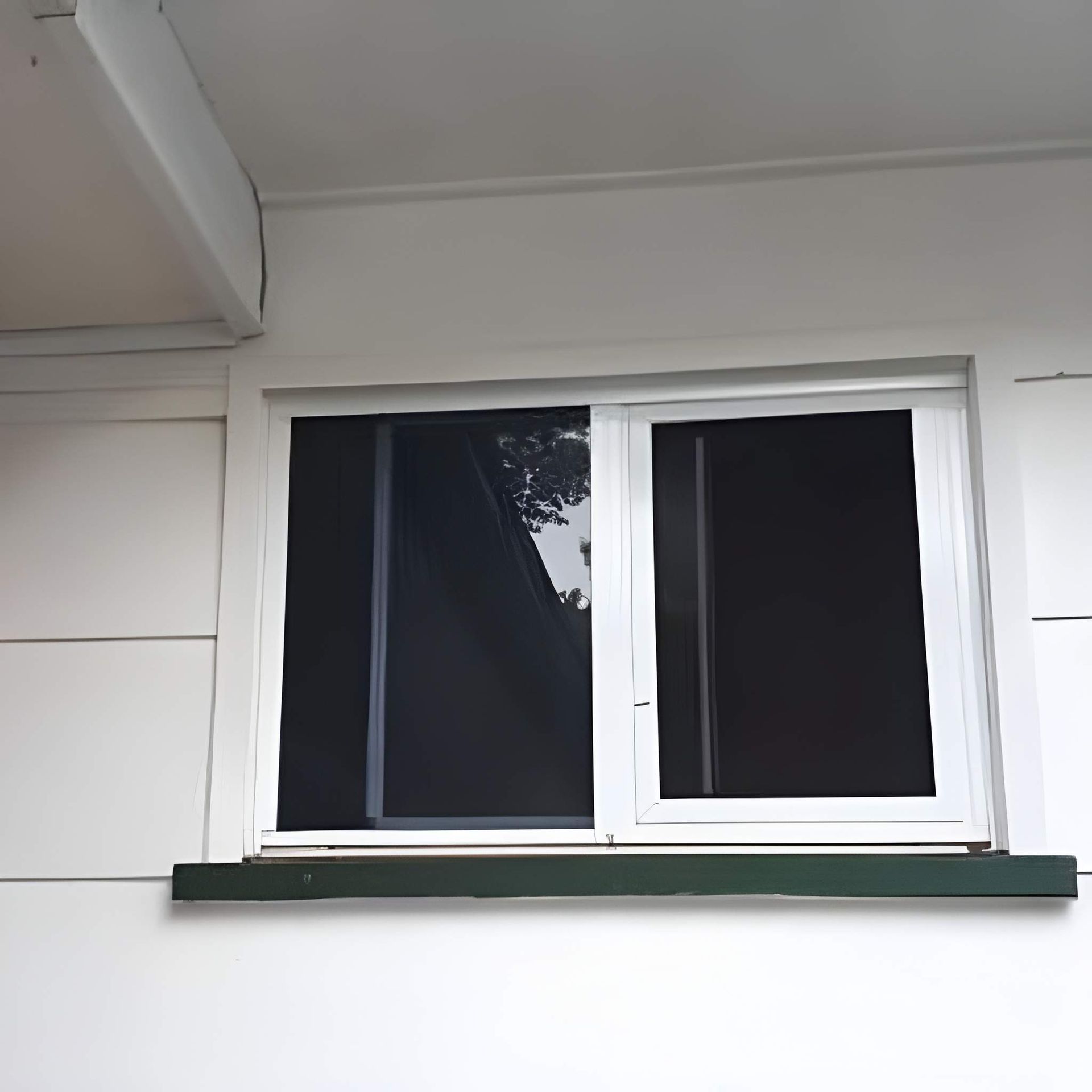 A White-Framed Window on A White House — Downs Window Renewals in Harristown, QLD