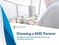 A man is sitting at a desk using a computer.